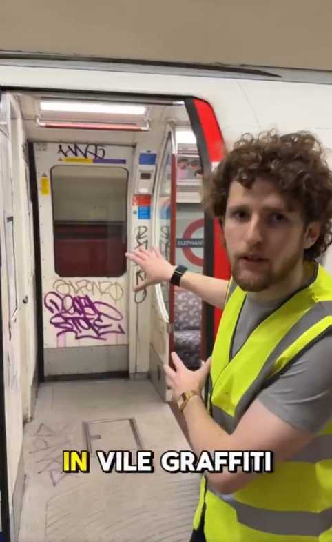 Clean Up Britain volunteer removing graffiti