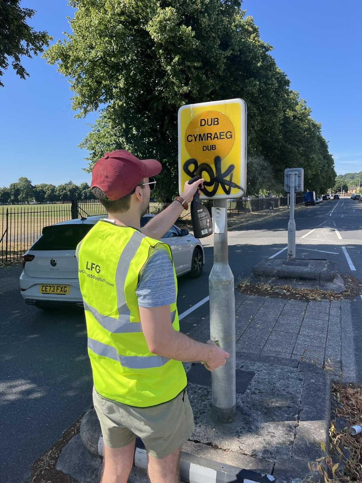 Volunteers clearing graffiti